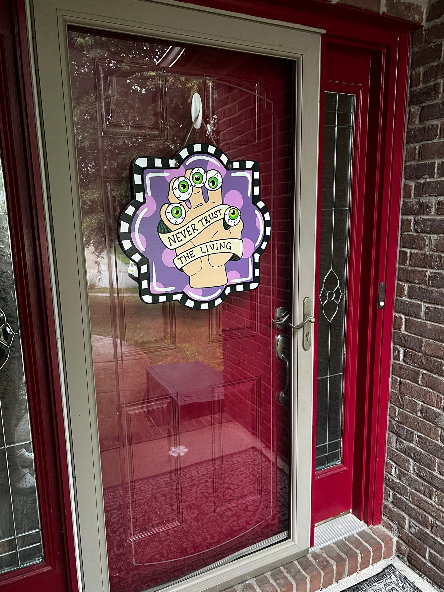 Never Trust The Living Door Hanger - Preorder